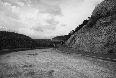 Scenic view of mountains against cloudy sky