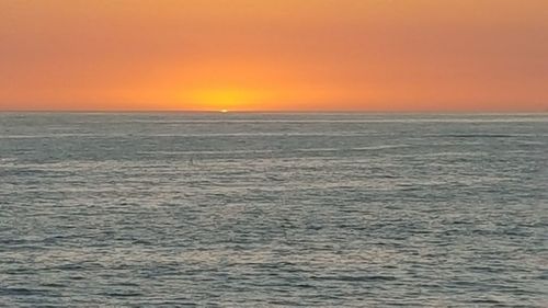 Scenic view of sea at sunset