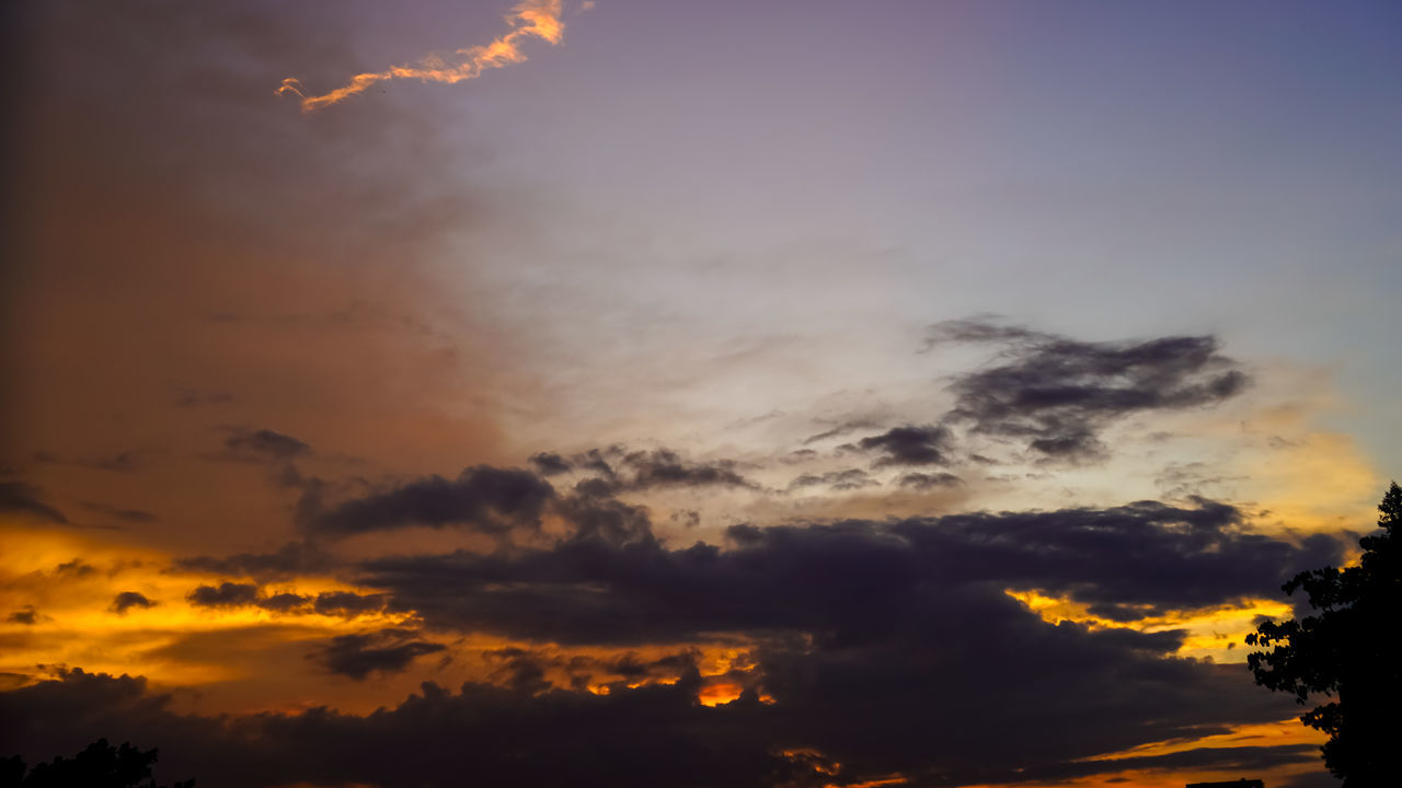 sky, cloud, sunset, beauty in nature, nature, dramatic sky, evening, scenics - nature, silhouette, environment, no people, afterglow, orange color, tree, tranquility, sunlight, outdoors, cloudscape, dawn, tranquil scene, red sky at morning, storm, atmospheric mood, plant, low angle view, idyllic, sun, awe, landscape