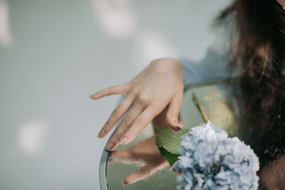 Woman standing with flower