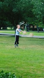 People walking on grassy park