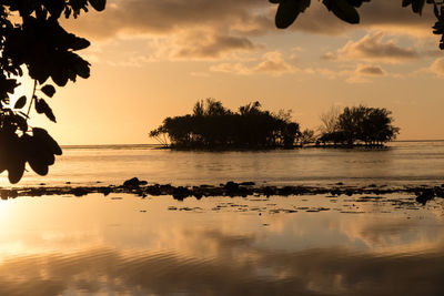 Scenic view of lake against sky during sunset