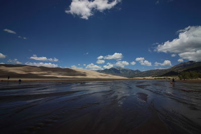View of lake against cloudy sky