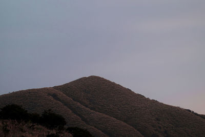 Low angle view of mountain against clear sky