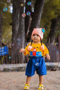 Portrait of cute girl playing with balloons