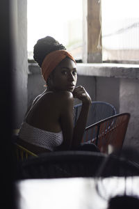 Young latin woman in balcony