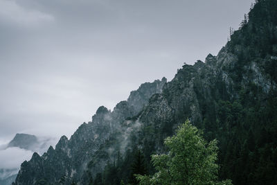 Low angle view of rocks against sky