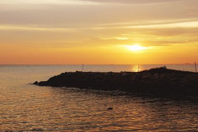 Scenic view of sea at sunset