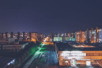 High angle view of illuminated buildings in city at night