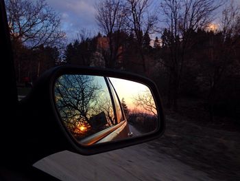 Reflection of car on side-view mirror