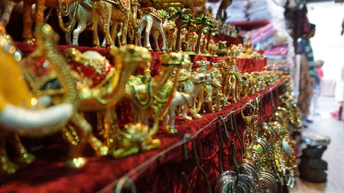 Golden camel figurines for sale in store