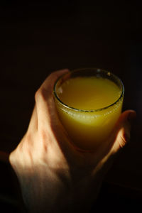 Close-up of person holding tea cup