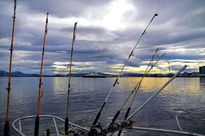 Scenic view of calm lake against cloudy sky