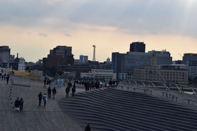 Buildings in city at sunset