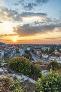 High angle view of buildings against sky during sunset