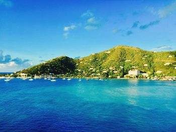 Scenic view of sea against blue sky