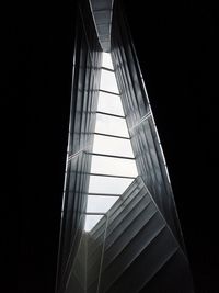 Low angle view of modern building against sky at night