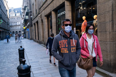 People walking on street in city