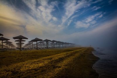 Scenic view of landscape against cloudy sky