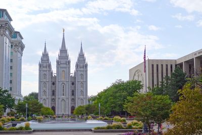 Salt lake city mormon temple and trees against sky