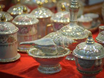 Close-up of illuminated glasses on table