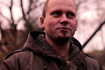 Close-up portrait of man looking away