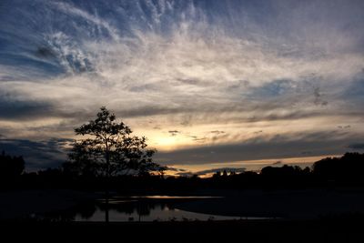 Scenic view of landscape against cloudy sky