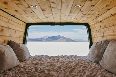 View of the bonneville salt flats from bed of camper van.