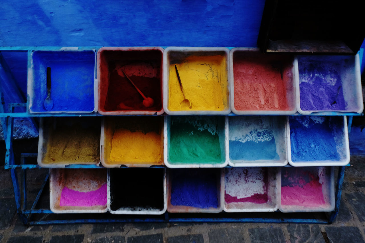 FULL FRAME SHOT OF MULTI COLORED OBJECTS IN SHELF