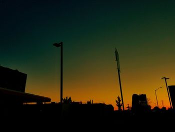 Low angle view of silhouette buildings against sky during sunset