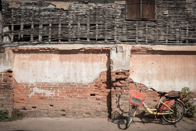 Bicycle against brick wall