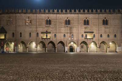 The ducal palace of mantua illuminated at night