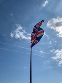 Low angle view of flag against sky