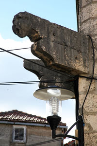 Low angle view of statue against sky