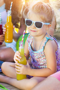 Close-up of a girl drinking glass