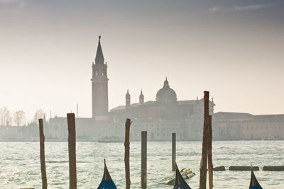 Cropped image of gondolas moored on grand canal against st marks square