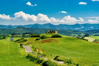 Scenic view of landscape against cloudy sky