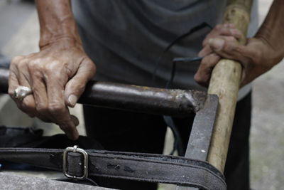 A man pushing wagon