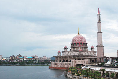 View of buildings against cloudy sky