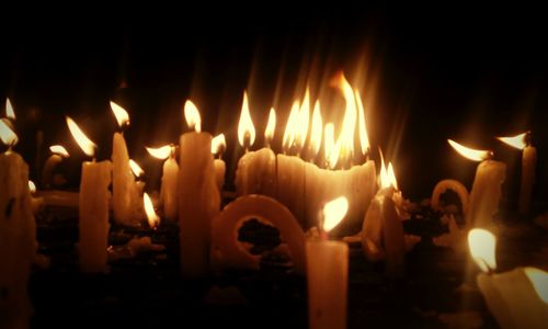 Close-up of burning candles