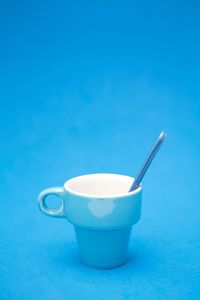 Close-up of drink against blue background