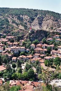 High angle view of townscape against mountain