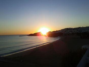 Scenic view of beach at sunset