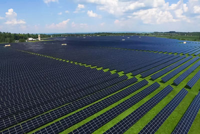 High angle view of solar panel on field against sky