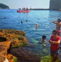 People swimming in sea