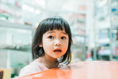 Close-up of cute girl in supermarket
