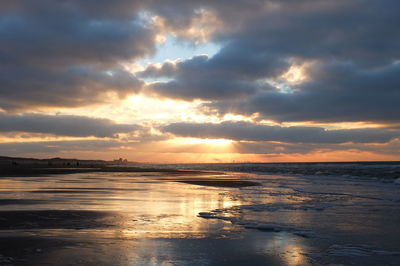 Scenic view of sea against dramatic sky