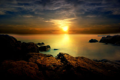 Scenic view of sea against sky during sunset