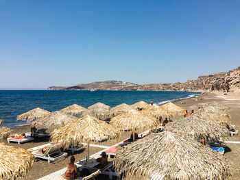 Scenic view of beach against clear blue sky