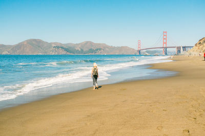 Woman standing on beach